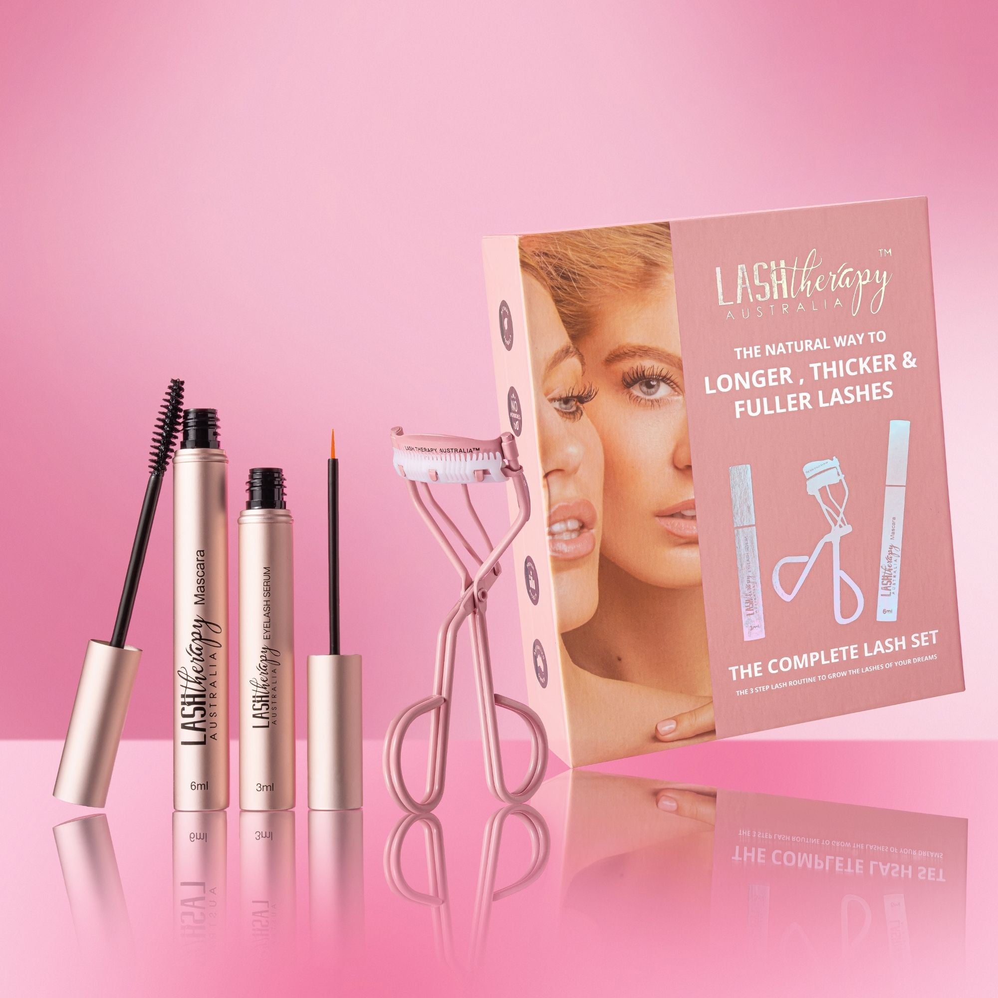 Lash Therapy Australia Complete Lash Set with lash growth serum, growth serum mascara, eyelash curler and applicator on pink background.