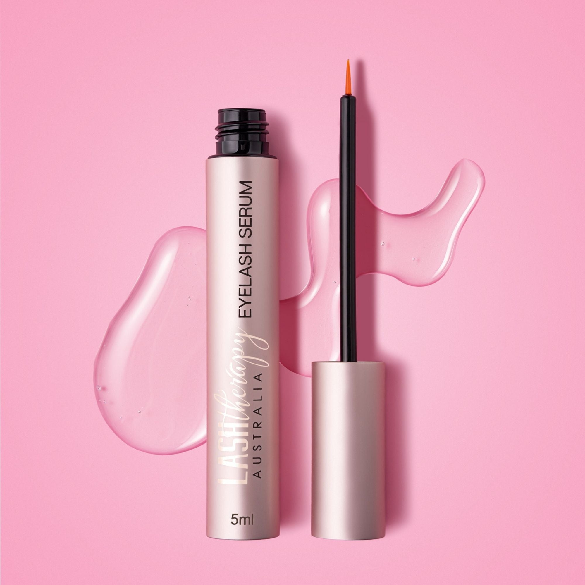 Lash Therapy Australia Jumbo Eyelash Growth Serum 5ml with precision applicator on pink background