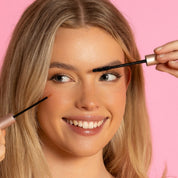 Model applying Lash Therapy Australia mascara with wand for longer fuller lashes.